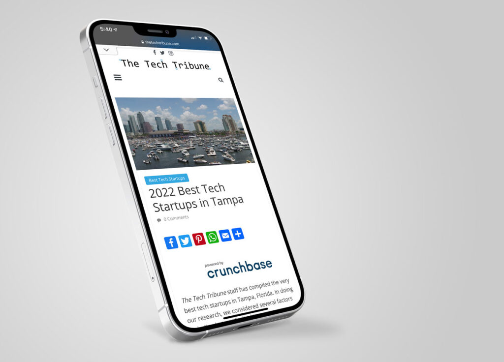 Iphone 13 with Tech Tribune website on Screen